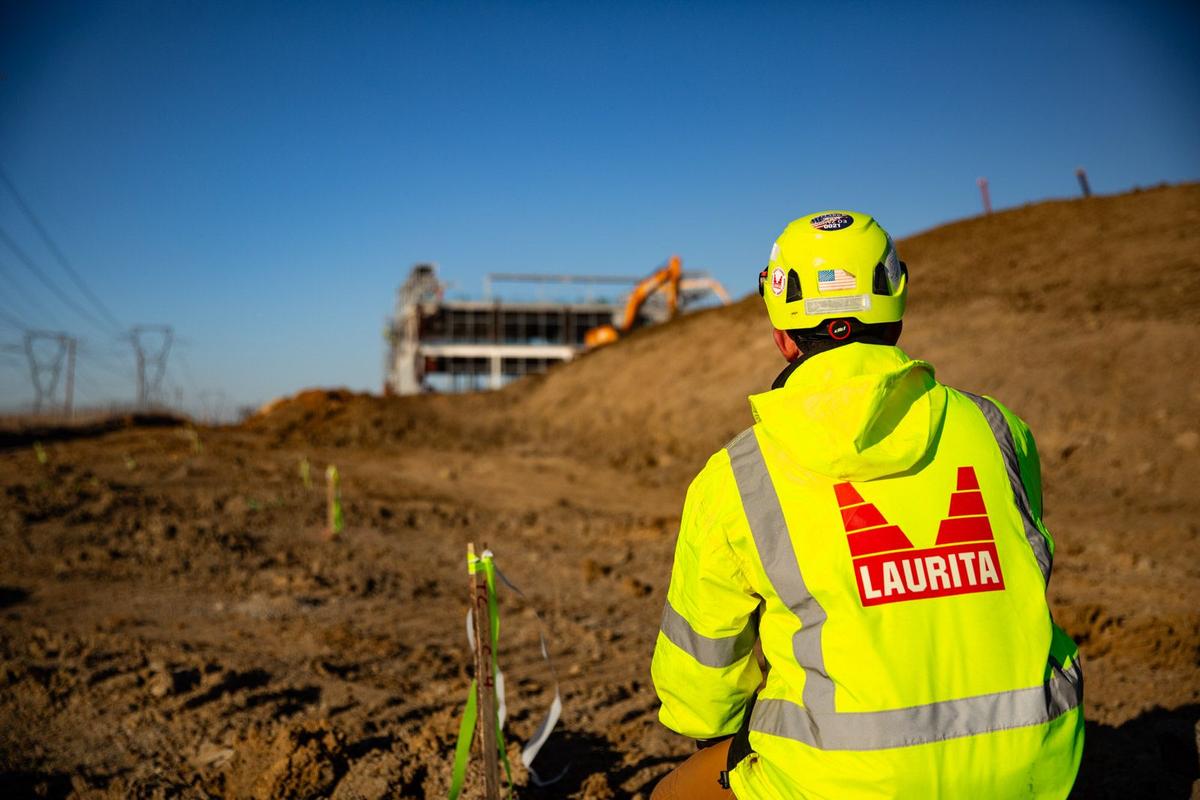 Construction workers collaborating on a project site